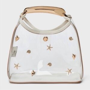a new day Clear Tote with Gold Sea Charm Accents and Cream Handles